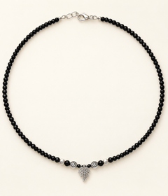 Single black anklet with charm