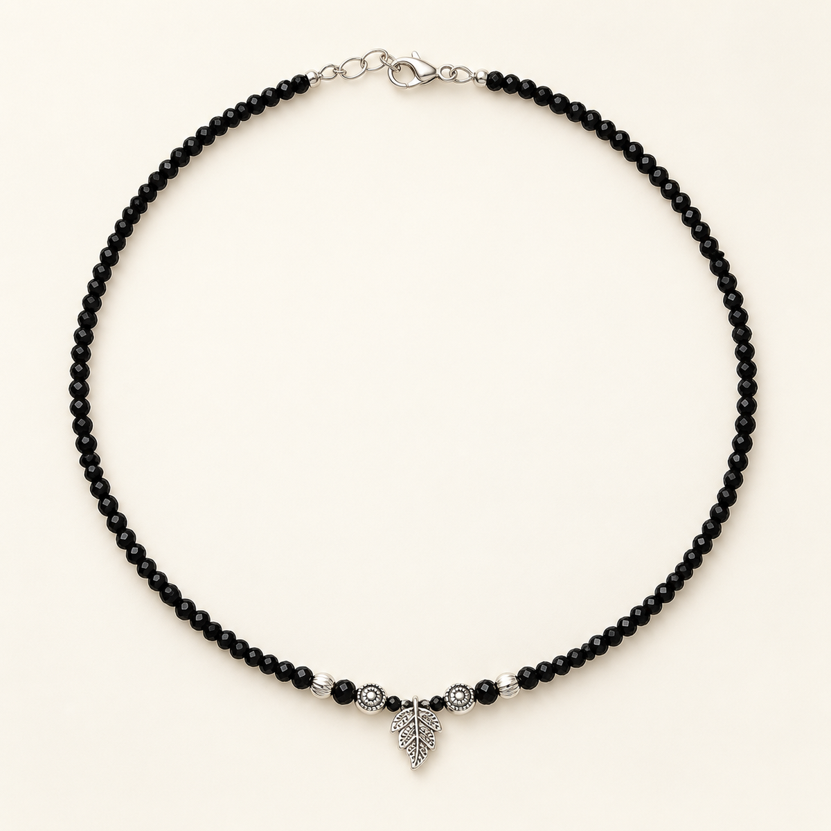 Single black anklet with charm
