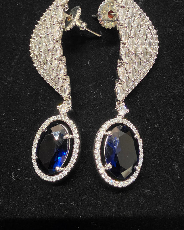 Silver toned diamond Earring with blue oval