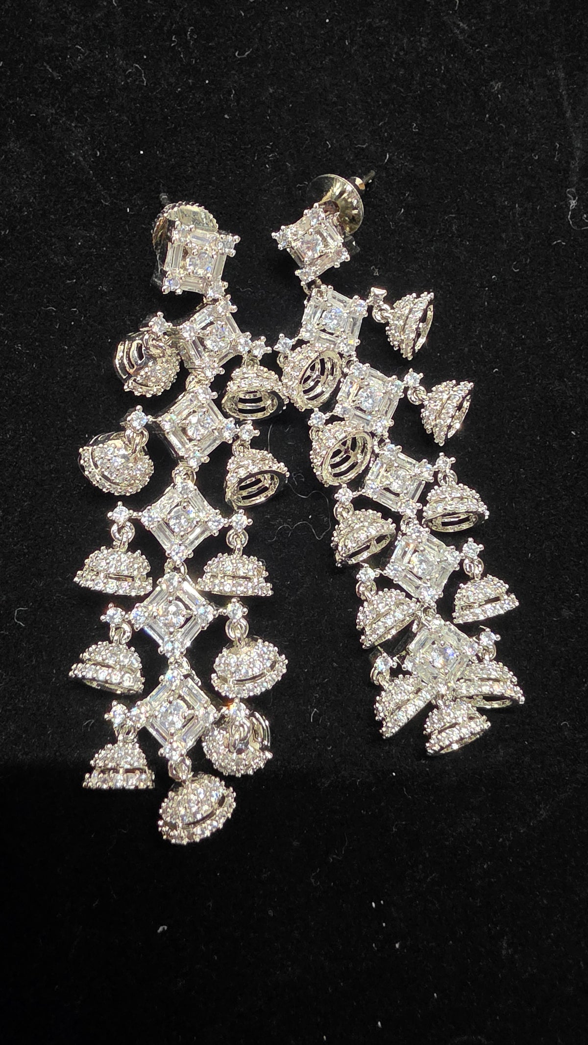 Silver toned long earring with small jumka